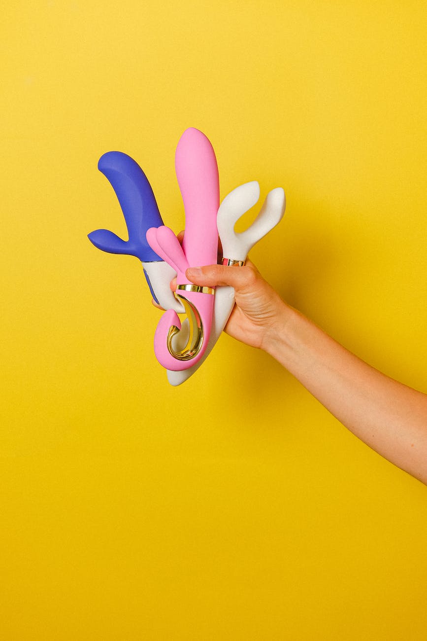 hand holding sex toys